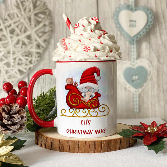 Red handled mug with the image of a cute Santa in a sleigh with personalised text.